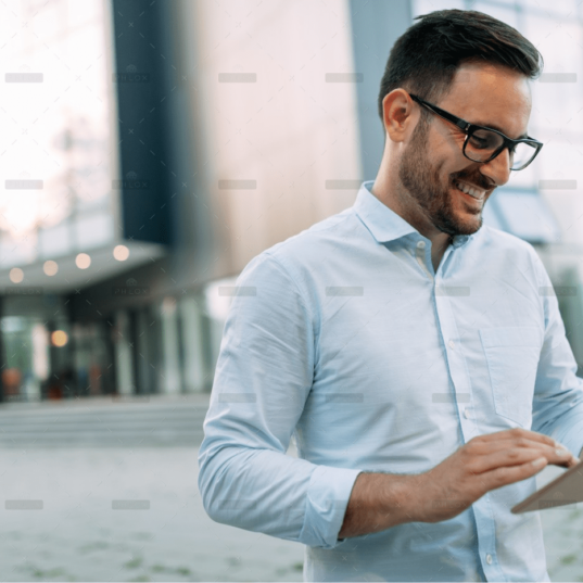 demo-attachment-1806-portrait-of-businessman-in-glasses-holding-tablet-AWVHCJU